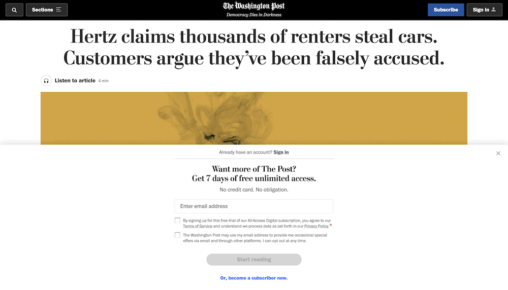 Witryna Washington Post, pokazująca płatną zaporę oferującą bezpłatną wersję próbną treści.